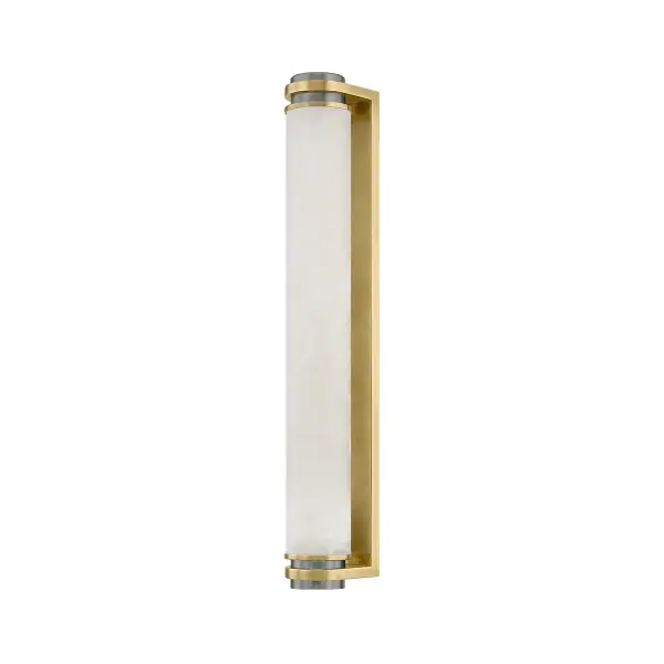 The Sorrento LED Wall Sconce combines timeless minimalist design with the organic beauty of natural alabaster. Its elongated tube silhouette and vintage brass finish create a sophisticated geometric contrast that works beautifully in both residential and hospitality settings.