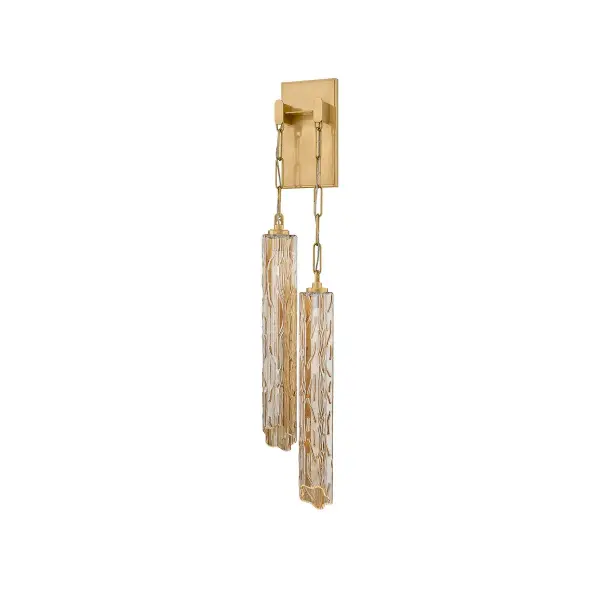 The Malaga brings artistic asymmetry and Old World craftsmanship to modern interiors. Hand-blown Tronchi glass shades with rippled texture hang from delicate chains, creating a jewelry-like statement piece with warm LED illumination.