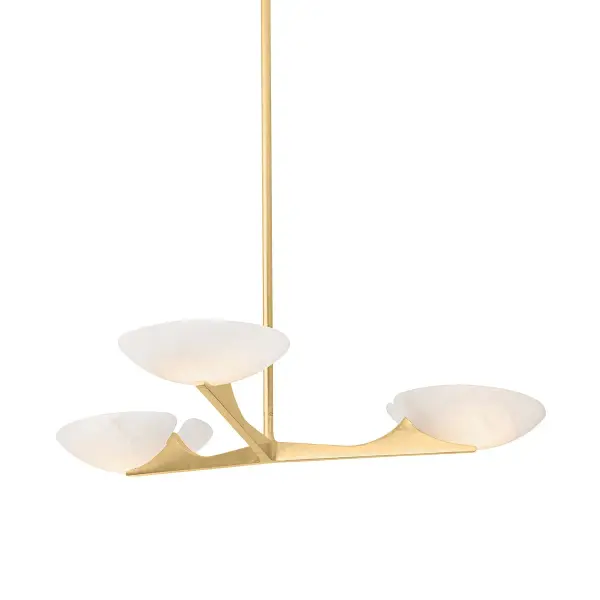 The Malachite chandelier combines elevated materials with clean modernist design. Three evenly-spaced arms radiate from a center point, each topped with a 10-inch alabaster bowl that diffuses warm, ambient light. The Vintage Gold Leaf finish adds luxury while maintaining versatility across contemporary and transitional interiors.