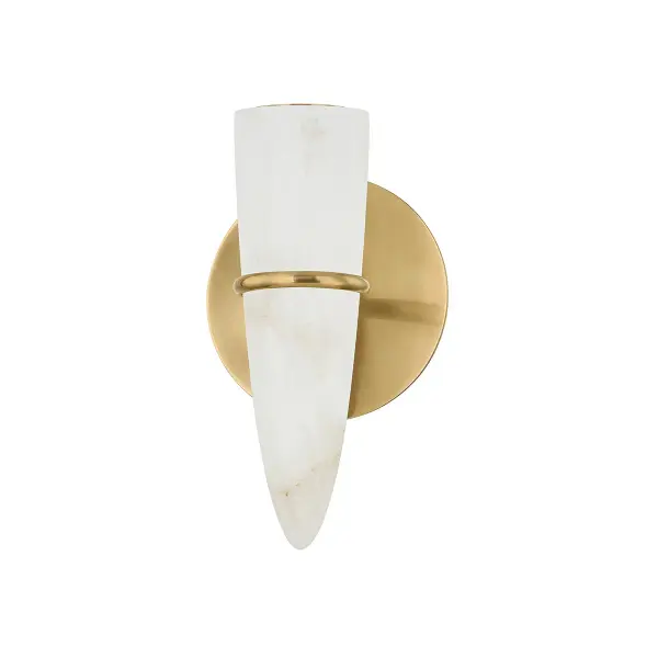 The Lombardy LED Wall Sconce combines artisanal craftsmanship with modern efficiency. Its natural alabaster shade, inspired by rock crystal formations, creates soft ambient lighting while the vintage brass bangle adds jewelry-like detail.