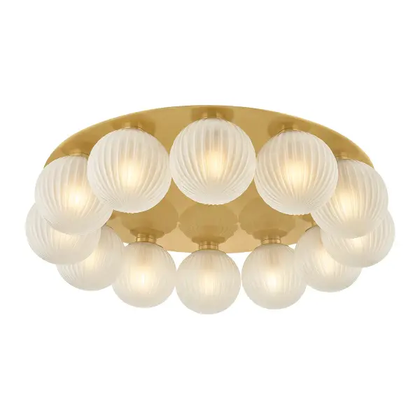 The Vernazza delivers chandelier-level drama in a flush mount profile. Its oversized 32-inch brass ceiling pan and 12 ribbed glass globes create a stunning focal point that bridges minimalist mounting with maximalist design.