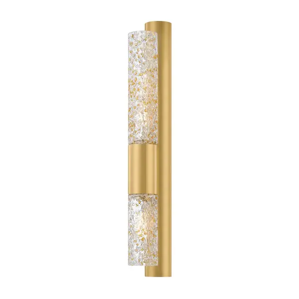 The Ivalo sconce combines minimalist design with rich texture through its specialty Doria glass featuring golden-amber specks that create an effervescent glow. The sleek Vintage Brass finish adds warmth and sophistication to any space.