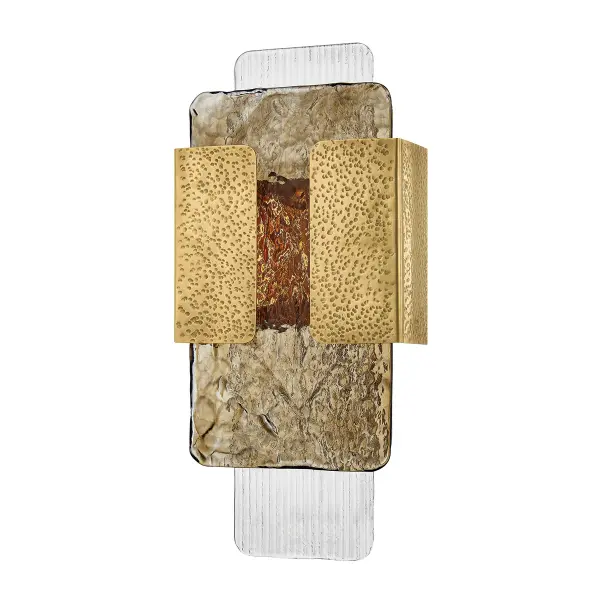 The Telluride sconce elevates wall lighting into an art form with its distinctive layered glass design. Topaz and clear ribbed piastre panels create mesmerizing texture and depth, while the cast brass holder adds modernist graphic appeal.