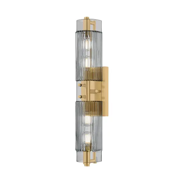 The Duoro sconce transforms functional bath lighting into a sculptural statement piece. Its totemic stacked glass shades in clear smoked piastre create visual drama while diffusing light beautifully, and the vintage brass frame adds warmth and sophistication.