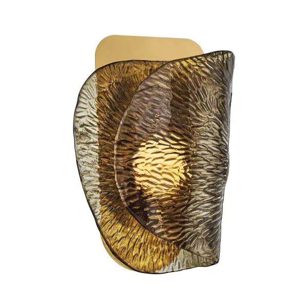 Klara's spiraling topaz glass shade creates a soft, translucent glow with vintage brass accents. The conch shell-inspired form adds sculptural elegance to intimate spaces, perfect for creating moody, romantic lighting.