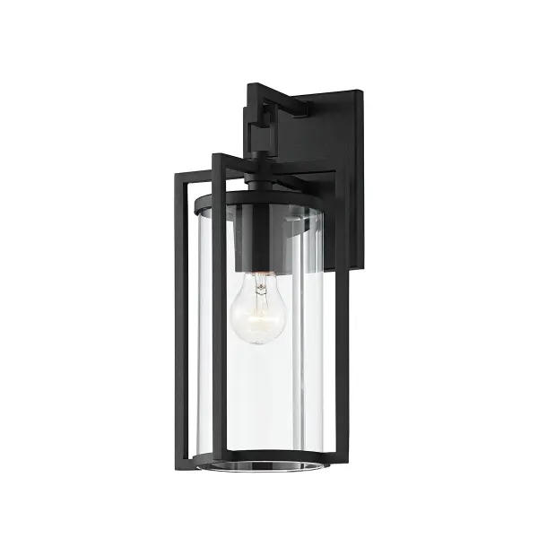 The Percy wall sconce delivers timeless transitional style with sharp geometric lines and a clean glass cylinder shade. Its wet-rated aluminum construction and textured black finish make it ideal for coastal and all-weather applications.