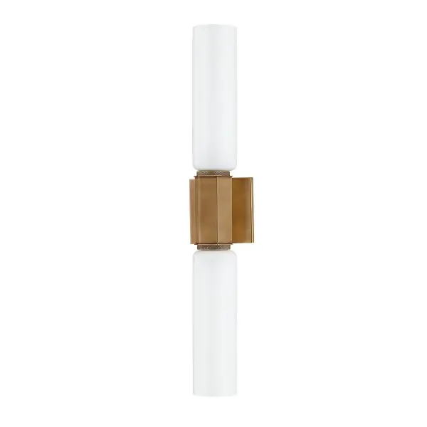 The Yarrow wall sconce combines streamlined modern design with refined detailing. Its dual opal glass cylinders provide excellent illumination while the knurled brass cuff adds visual interest and sophistication.