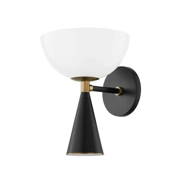 The Payson wall sconce combines vintage charm with contemporary design through its dome-shaped etched glass shade and contrasting Patina Brass and Soft Black finishes. Versatile mounting options allow for uplight or downlight configurations.