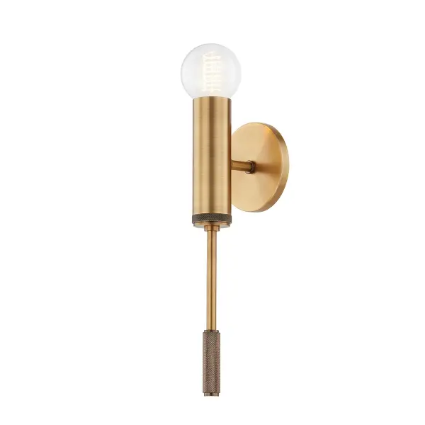 The Chino wall sconce brings modern minimalism with industrial flair through its branch-like patina brass arms and exposed bulb design. Knurled detailing adds tactile interest while the soft black hexagonal center creates subtle contrast.