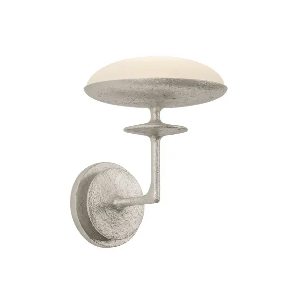 The Pacific LED Wall Sconce combines architectural geometry with handcrafted texture. Its warm silver leaf finish and etched glass create sophisticated ambient lighting perfect for modern interiors seeking understated elegance.