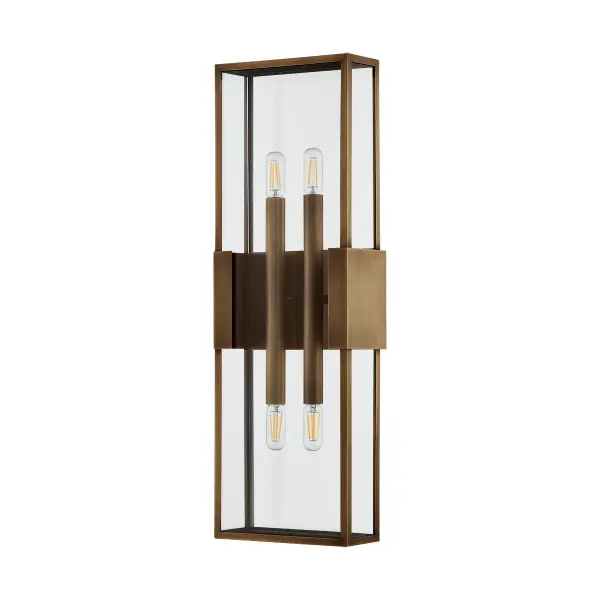 Santa Clara reimagines the classic box lantern with clean lines and maximum transparency. The Patina Brass metalwork is minimal yet refined, with elegant flanges extending from the backplate like jewelry clasps. Wet-rated for durability.