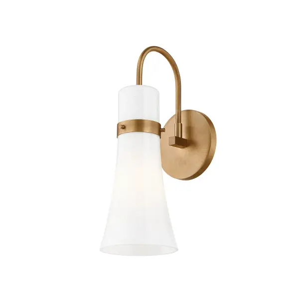 The Maple sconce blends vintage charm with modern sensibility through its organically curved seeded opal glass shade and refined Patina Brass finish. Compact at under 5 inches wide, it delivers sophisticated style without overwhelming smaller spaces.