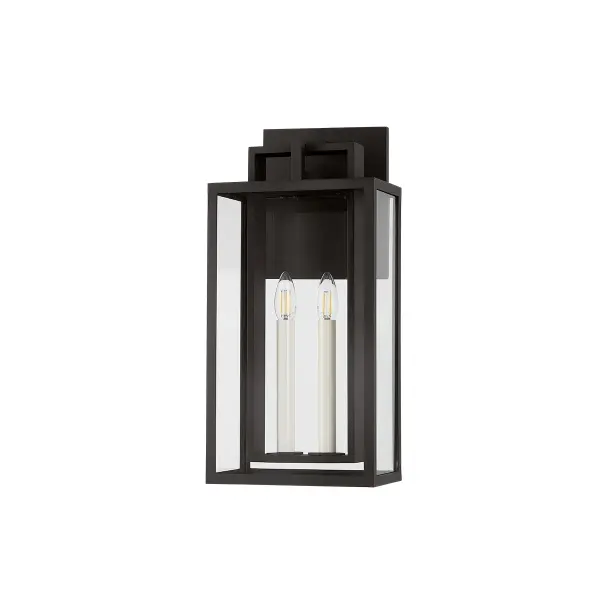The Amire 2-light sconce combines architectural minimalism with practical outdoor lighting. Its layered aluminum frame and clear glass panels create an airy, modern aesthetic while providing excellent illumination for entryways and exterior walls.