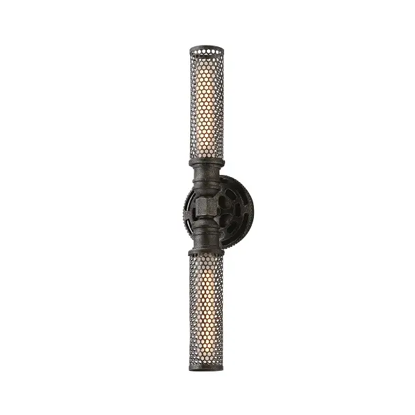 The Atlas wall sconce brings industrial sophistication to any space with its hand-worked iron construction and aged pewter finish. Its compact 5.25-inch width makes it ideal for tight spaces while delivering ample illumination through dual bulbs.
