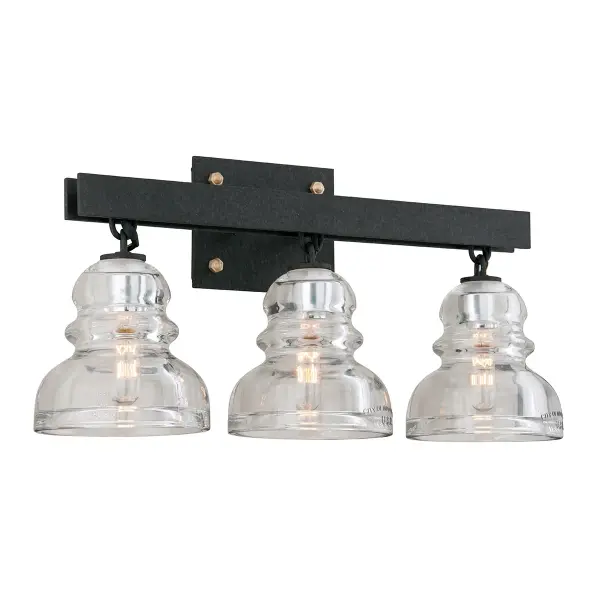 The Menlo Park vanity light brings authentic industrial character to bathroom spaces with hand-worked textured iron and clear glass shades. Its 20.5-inch width makes it ideal for medium vanities and powder rooms.
