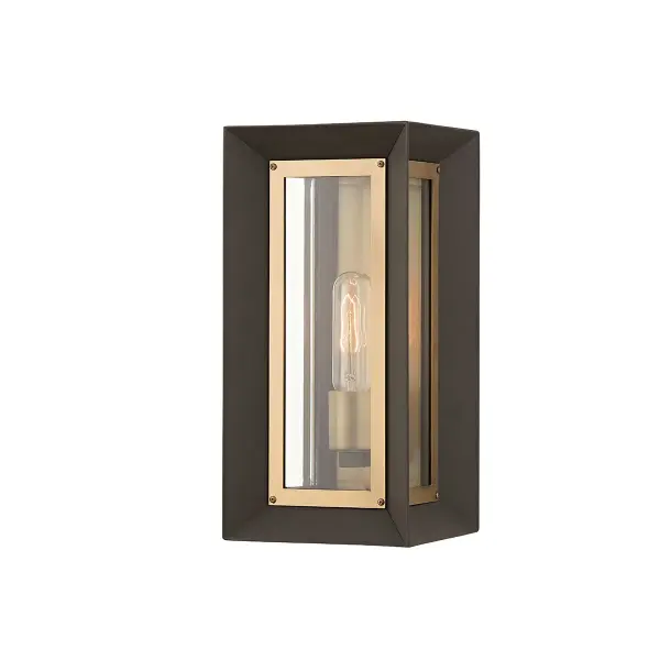 The Lowry wall sconce delivers design-driven style with its inverted cube form, combining textured bronze aluminum and patina brass accents. Clear beveled glass adds refinement while the wet-rated construction ensures durability.