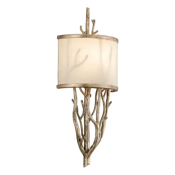 The Whitman wall sconce combines traditional hand-worked iron with a clean transitional silhouette. Its compact 7.75" width and white linen shade provide soft, diffused light ideal for intimate spaces.