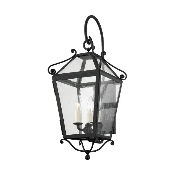 Designer Mark D. Sikes brings coastal California glamour to this dramatic outdoor sconce. Decorative scrollwork and substantial scale deliver classic Spanish colonial style with modern wet-rated durability.