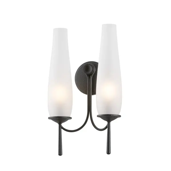 The Legacy sconce reimagines the traditional hurricane lamp with gracefully curved arms and rich forged iron finish. Clear etched glass shades soften the light beautifully, while antique tail details add historic charm.