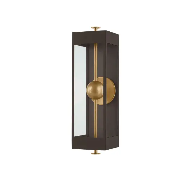 The Garvey sconce elevates the traditional box lantern with a striking vertical rod and suspended LED bead design. The reflective panel amplifies light output while the contrasting Textured Bronze and Patina Brass finishes add sophisticated visual depth. Wet-rated for versatile indoor and outdoor use.