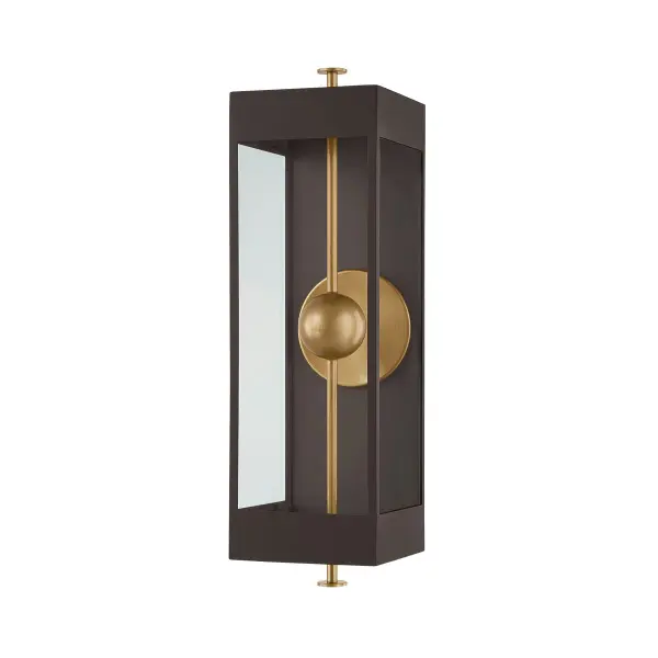 The Garvey sconce transforms the classic box lantern with a striking vertical rod and suspended LED bead. The reflective panel amplifies light while the contrasting Textured Bronze and Patina Brass finishes add sophisticated depth.