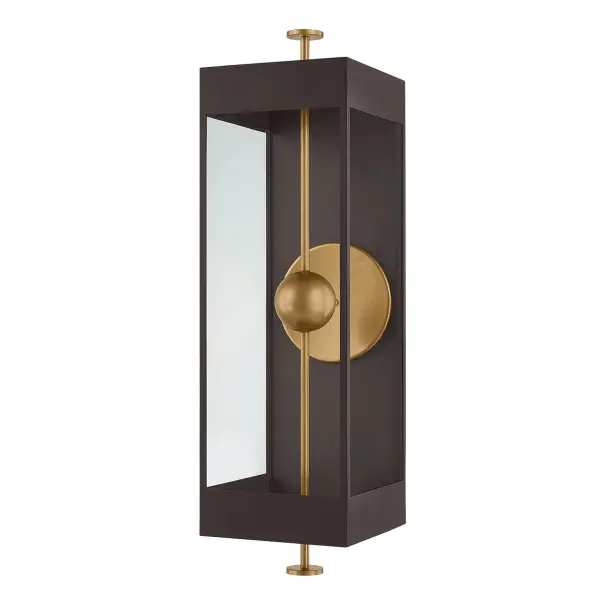 The Garvey sconce transforms the classic box lantern with a striking vertical rod and suspended LED bead. The contrasting Textured Bronze and Patina Brass finishes create sophisticated visual depth, while the reflective panel amplifies light output. Wet-rated for versatile indoor and outdoor use.