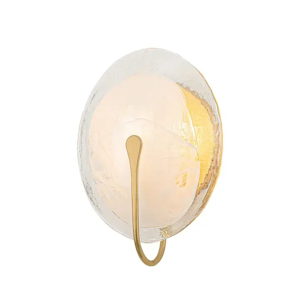 The Valley sconce transforms functional lighting into wall art with its textured remolino blanco glass and gracefully curved vintage gold leaf arm. Perfect for intimate spaces requiring soft, diffused illumination with sculptural presence.