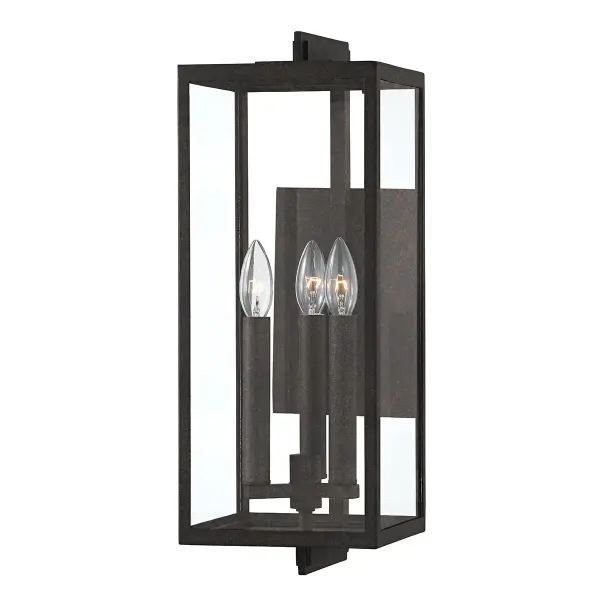 The Nico three-light wall sconce brings contemporary style to outdoor spaces with its dimensional French Iron finish and clear glass panels. The iron cage design adds industrial character while remaining versatile enough for various architectural styles.