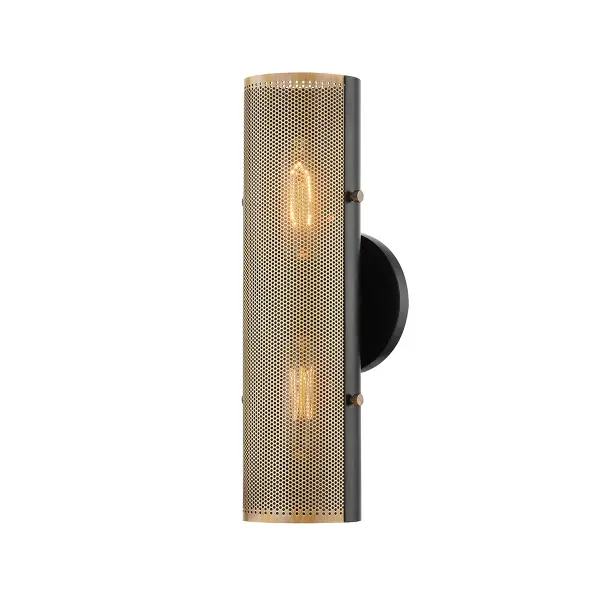 A striking two-tone wall sconce that combines perforated Patina Brass with Soft Black backing to create dramatic light patterns. The exposed pins add authentic industrial character while the compact size makes it versatile for various spaces.