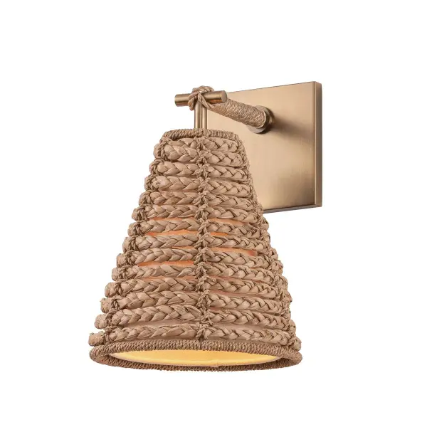 The Redwood sconce brings relaxed coastal elegance with its abaca rope-wrapped linen shade and nautical knot detail. The patina brass finish adds warmth while the natural materials create dimensional, diffused lighting perfect for intimate spaces.
