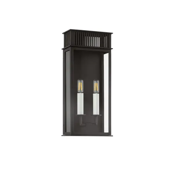 The Gridley wall sconce beautifully bridges past and present with its gas lantern-inspired design and clean box silhouette. The vented roof detail adds character while the textured black finish ensures durability in outdoor conditions.
