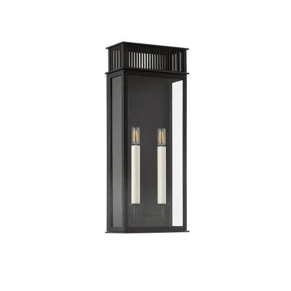 The Gridley wall sconce beautifully bridges past and present with its gas lantern-inspired design and clean box silhouette. The vented roof detail adds character while the textured black finish ensures durability and style for any outdoor setting.