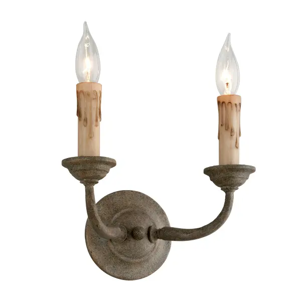 The Cyrano wall sconce showcases hand-worked iron craftsmanship in an earthen bronze finish. Its compact 11-inch profile and dual-light design make it ideal for flanking mirrors, artwork, or architectural features in traditional and transitional spaces.