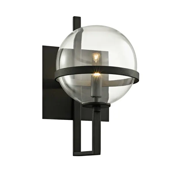 The Elliot wall sconce combines contemporary industrial design with artisanal metalwork. Its compact 6.5-inch profile and textured black finish make it ideal for smaller spaces requiring focused task or accent lighting.
