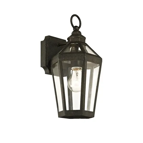 The Calabasas wall lantern brings traditional charm to outdoor spaces with hand-worked iron construction and a vintage bronze finish. Its compact 7-inch width and wet-rated design make it ideal for entryways and porches.