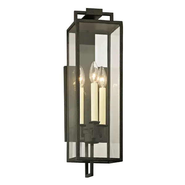 The Beckham wall lantern delivers sophisticated outdoor lighting for large-scale homes. Its elongated silhouette modernizes the traditional box lantern form, while hand-worked iron and clear glass provide timeless appeal.