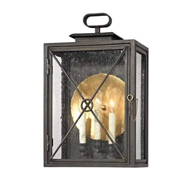 The Randolph wall lantern combines traditional craftsmanship with durable outdoor construction. Hand-crafted iron and brass construction with clear seeded glass creates timeless curb appeal. Wet-rated for exposed locations.