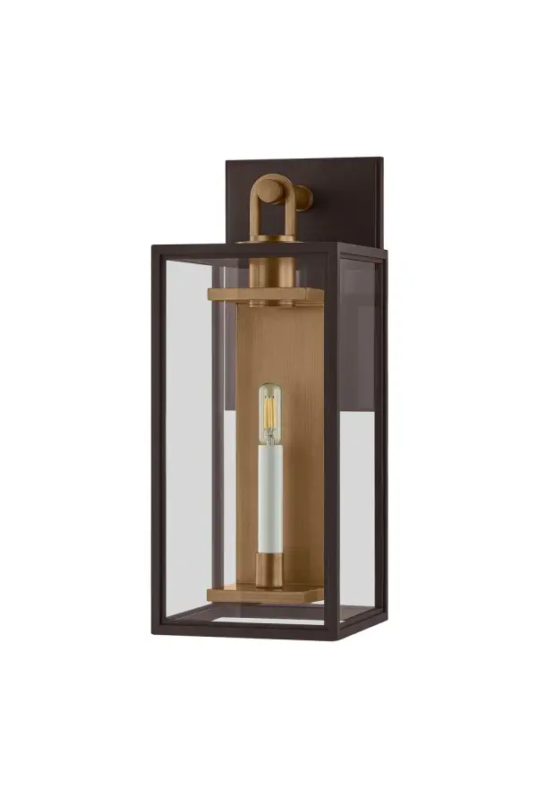 The Arnold sconce combines traditional lantern styling with modern geometric lines and mixed metal finishes. Its EPM construction resists UV and salt exposure, making it ideal for coastal and high-exposure locations.