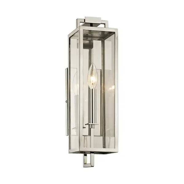 The Beckham sconce combines sleek geometry with timeless lantern design, featuring an elongated silhouette perfect for grand home exteriors. Its polished stainless steel finish and wet-rated construction ensure durability.
