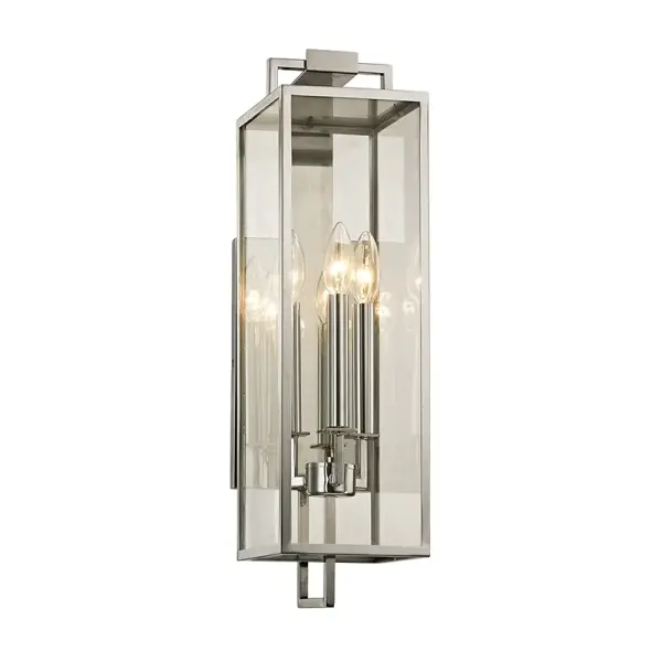The Beckham sconce combines sleek geometry with traditional lantern styling in a durable stainless steel finish. Its elongated 21.5-inch silhouette makes a bold statement on large homes while three candelabra bulbs provide warm ambient lighting.