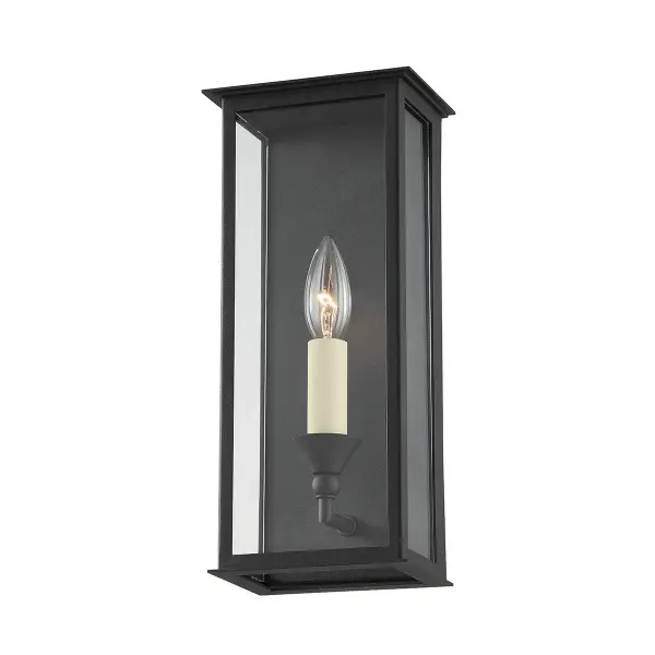 The Chauncey wall sconce combines classic lantern styling with contemporary clean lines. Its texture black finish and clear glass panels create elegant curb appeal while the wet-rated construction ensures durability.