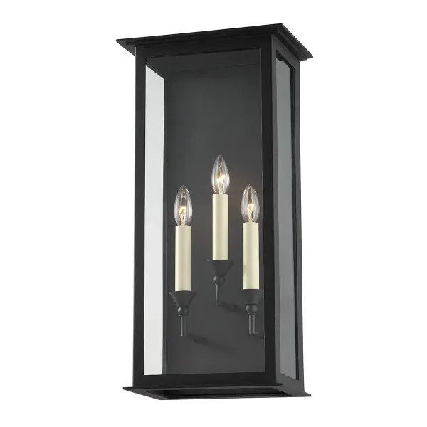 The Chauncey outdoor wall sconce combines classic lantern design with contemporary clean lines. Its Texture Black finish and clear glass panels create elegant curb appeal while the wet-rated construction ensures durability.