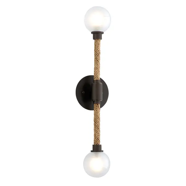 The Nomad wall sconce combines hand-worked iron in classic bronze with opal glass for a refined, vertical profile. Its compact 5-inch width and 23.75-inch height make it ideal for narrow spaces, while integrated LED provides energy-efficient illumination.