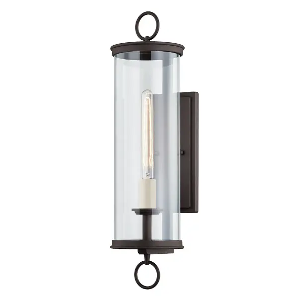 The Aiden wall sconce combines transitional styling with robust outdoor performance. Hand-crafted aluminum construction with textured bronze finish and clear glass creates sophisticated illumination for exterior spaces.
