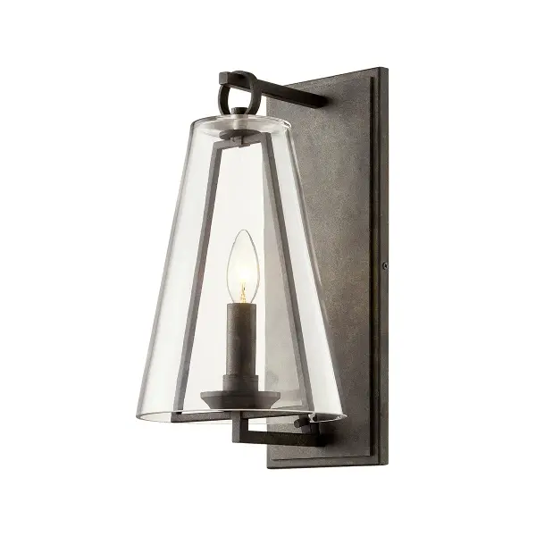The Adamson wall sconce combines handcrafted aluminum construction with a French Iron finish and clear glass shade. Its wet-rated certification and compact 8-inch profile make it ideal for both indoor and outdoor applications.