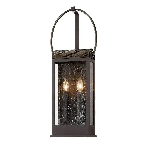 The Holmes sconce combines traditional styling with modern durability. Hand-crafted aluminum construction and wet-rated certification make it ideal for exposed outdoor locations. Clear seeded glass adds vintage charm.