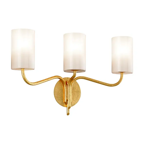 The Juniper three-light vanity fixture brings sophisticated warmth to bathroom spaces with its hand-worked iron construction and luxurious gold leaf finish. Opal glossy glass shades provide even, flattering illumination.