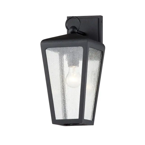The Mariden wall sconce combines industrial charm with practical outdoor performance. Its textured iron finish and clear seeded glass create visual interest while the wet-rated construction ensures reliable year-round use.