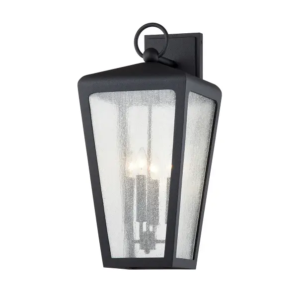 The Mariden wall sconce brings industrial character to outdoor spaces with hand-crafted aluminum construction and textured iron finish. Its substantial 25.5-inch height and wet-rated certification make it ideal for exposed exterior locations.