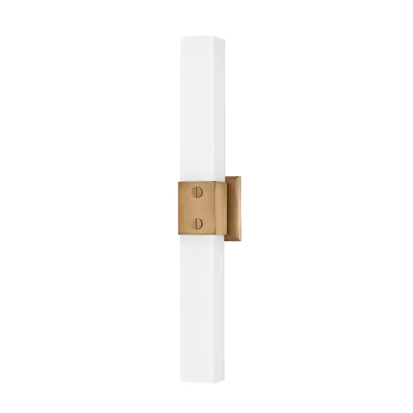 The Jonah vanity light masterfully blends industrial aesthetics with refined details. Its clean-lined steel body in warm patina brass is elevated by acid-etched opal glass and distinctive jewelry-inspired hardware, creating a sophisticated yet approachable look perfect for modern bathrooms.